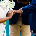 Bride and groom exchange rings in outdoor surprise ceremony
